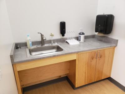 image of sink and cleaning supplies in lactation room